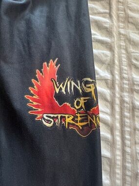 Wing of Strength Women's Black Leggings with Red Graphic